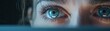 Detailed view of a concerned eye observing a laptop alert for hacking attempts, underlining the importance of secure online practices and personal information protection