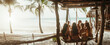 © Hoss - A wide angle photo, girls laughing and relaxing as a group of girls sit on a tropical beach swing. They sit in a swing wearing swim suits looking at the blue ocean, spring break, bachelorette, pano