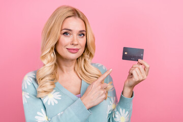 Sticker - Photo of pleasant woman with wavy hairdo dressed print cardigan directing at debit card in fingers isolated on pink color background