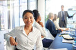 © peopleimages.com - Woman, employee and smile on portrait in boardroom with pride for career grow and opportunity as accountant. Female person, people and office for business presentation with statistics for feedback