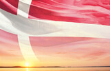 Fototapeta  - Denmark national flag waving in the sky.