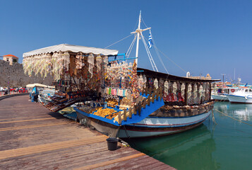 Wall Mural - Craft and souvenir boat at Rhodes Harbor, Greece