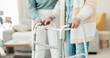 © peopleimages.com - Woman, hands and walker in elderly care for physiotherapy, support or trust at old age home. Closeup of female nurse or caregiver walking and helping patient or person with a disability in the house