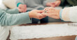 © peopleimages.com - Woman, holding hands and support group for elderly care or trust for unity, community or social gathering at home. Closeup of women touching hand in teamwork activity, understanding or collaboration