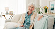 © peopleimages.com - Happy, senior woman and relax on sofa in nursing home or grandma with happiness, freedom and retirement in house. Portrait, elderly person and smile in living room or thinking of good memory