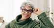 © peopleimages.com - Happy, face and senior woman on sofa to relax in home or grandma laughing with happiness and freedom in retirement. Portrait, elderly person and smile in living room, house or thinking of good memory