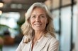 © Serhii - Success Image - Smiling Senior Businesswoman with Confidence and Happiness