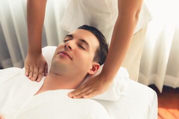 caucasian man customer enjoying relaxing anti-stress spa massage and pampering with beauty skin recr