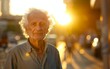 © imagineRbc - An older man standing alone on a city street during golden hour, the setting sun casting long shadows behind him