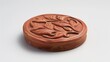 Medallion made of red clay with a leaf pattern