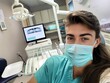 Woman in Dentist Chair Wearing Mask