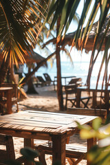 Wall Mural - Cozy details of exotic beach bar framed by palm leaves. Spending holidays in tropical destinations.