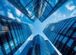 © DWN Media - Stunning shot of modern skyscrapers against the blue sky, low angle perspective, stock photo, high resolution photography.