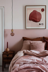Wall Mural - A bedroom wall with a pink painted border, featuring a poster of an abstract shape and a wooden bedside table adorned with dark brown linen bedding. The room also includes a hanging pendant light.