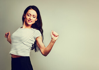 Wall Mural - Beautiful young business woman relaxing with straighten the shoulders and the shoulder blades in casual summer clothing on studio background with empty copy space. Closeup portrait