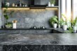 © At My Hat - A kitchen with a marble countertop and a window with potted plants. The kitchen is clean and well-organized