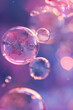 Pink and purple bubbles on a dark background