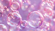Pink and purple bubbles on a dark background
