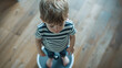 © Generative AI - The child stands on the floor scales in a striped Tshirt the view from the top Health : Generative AI
