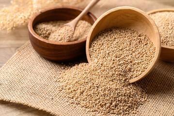 Wall Mural - Brown quinoa seed in wooden bowl, Healthy food ingredient