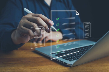 Document management system DMS. Assessment form, questionnaire, checklist and clipboard task management. Businessman working on laptop computer productivity checklist and filling survey form online.