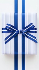 A blue and white gift box adorned with a striped ribbon, creating an elegant presentation