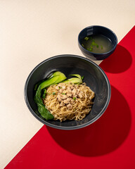 Wall Mural - Typical Hong Kong yamin noodles topped with chicken and served with vegetables