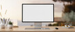 © bongkarn - A PC computer mockup and accessories on a wooden desk with a blurred background of an outdoors.