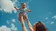 © The Little Hut - Mother throwing baby up against the blue sky Happy family outdoors Mom and baby at summer on nature Positive human emotions and feelings : Generative AI