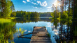 © Mangata Imagine - Beautiful summer landscape with lake and old wooden dock in forest on sunny day, bright blue sky with sun rays. Scandinavian nature background. Summer vacation concept