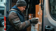 © Nelson - Man Loading Boxes Into Van