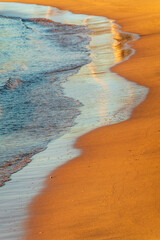 Wall Mural - Soft wave of the sea on the sandy beach.