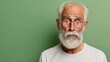 © Mikus - An old man in glasses and a white beard gazes at the camera, shocked expression