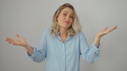 Poster - Young blonde woman in a shirt sporting a clueless expression, hands raised, exuding a vibe of confused indifference with a shrug on an isolated white background