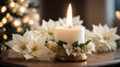 Glowing candle illuminates ornate christmas decoration indoors with white poinsettia