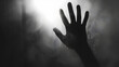 © Generative AI - Defocused hand silhouette behind frosted glass in black and white mode halloween concept : Generative AI