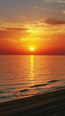 Wall Mural - moving over sand beach and calm sea surface during a beautiful sunset. vertical video
