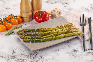 Canvas Print - Grilled asparagus sprouts served red pepper