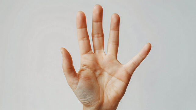 female hand showing four fingers on white background -
