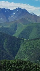 Wall Mural - Aerial view on high Caucasus Mountains, Republic of Ingushetia, Russia. Vertical video