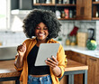 © Lumos sp - Portrait of a young woman looking at a tablet at home