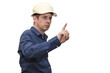 © Anoo - A man in a hard hat is pointing his finger, taking charge and giving instructions. Isolated.