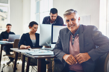 Wall Mural - Mature man, portrait and happy in office with computer for research and product development for company with innovation. Business people, technology and online for problem solving and proposal.