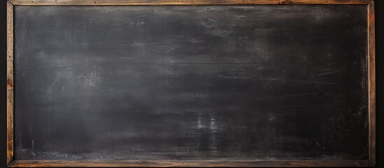Poster - Image of a blank chalkboard with erased marks providing a clean surface for educational purposes. copy space available