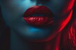 © anatolir - Closeup of woman's lips with red lipstick, illuminated by blue light with a shadowy backdrop