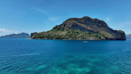 Wall Mural - The Aerial view of white sand beach bathed by a crystal clear water. Entalula island, Bacuit Bay, El Nido, Palawan, Philippines.