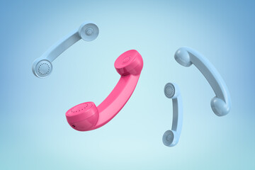 Wall Mural - 3d rendering of three blue and a pink retro telephone receivers on blue background