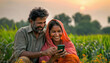 © PRASANNAPIX - Indian farmer using smartphone with wife at agriculture field