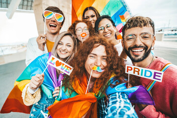 Wall Mural - Diverse group of cheerful young people celebrating gay pride day - Lgbt community concept with guys and girls hugging together outdoors