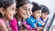 © PRASANNAPIX - indian school children learning on digital tablets